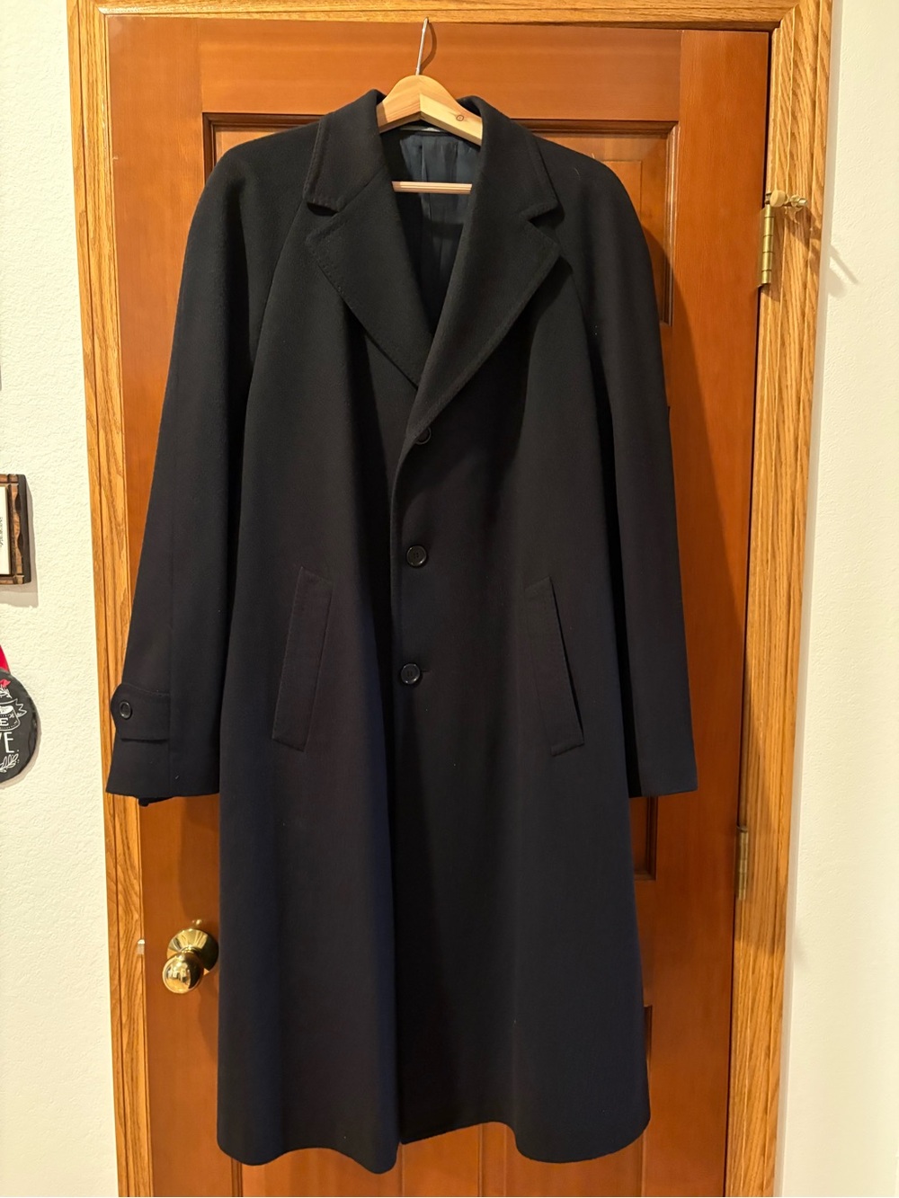 Men’s black, single breasted 100% pure cashmere topcoat. Barney’s New York